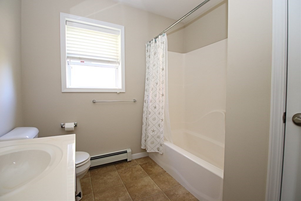 10 Pace Road Saugus, MA 01906 - Photo 34 of 42 a bathroom with a shower a toilet and a sink