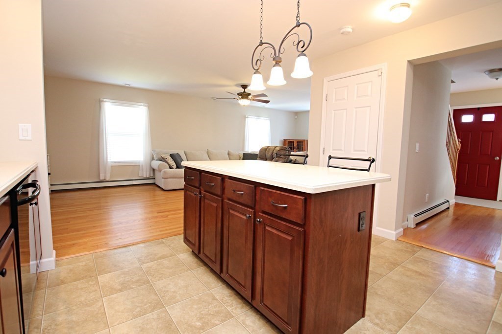 10 Pace Road Saugus, MA 01906 - Photo 10 of 42 a kitchen with a sink a counter space and cabinets