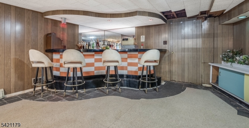 1868 Amwell Road Somerset, NJ 08873 - Photo 14 of 20 a room with lots of chairs and mirrors