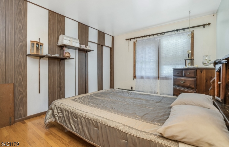 1868 Amwell Road Somerset, NJ 08873 - Photo 9 of 20 a bedroom with a large bed and a dresser