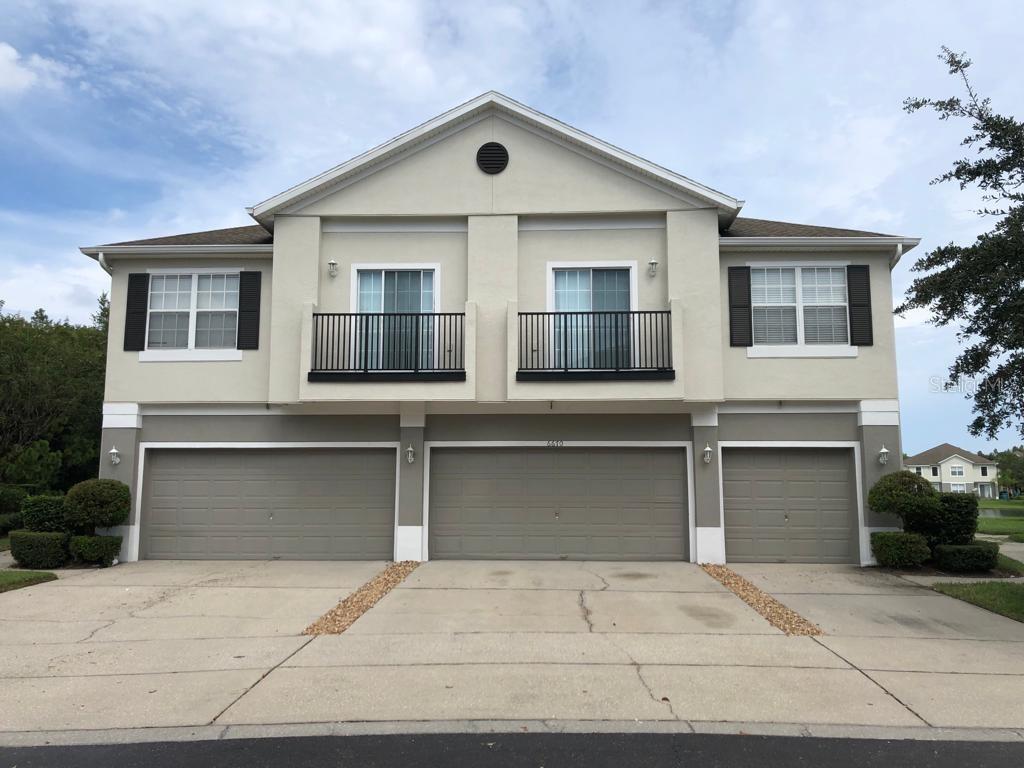 a front view of a house with garage