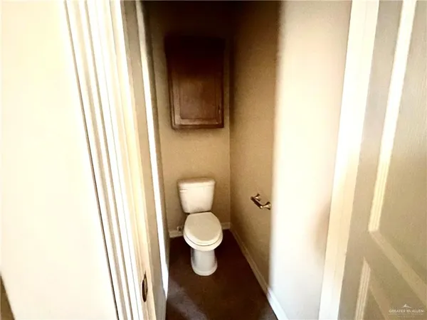 a bathroom with a toilet and a sink