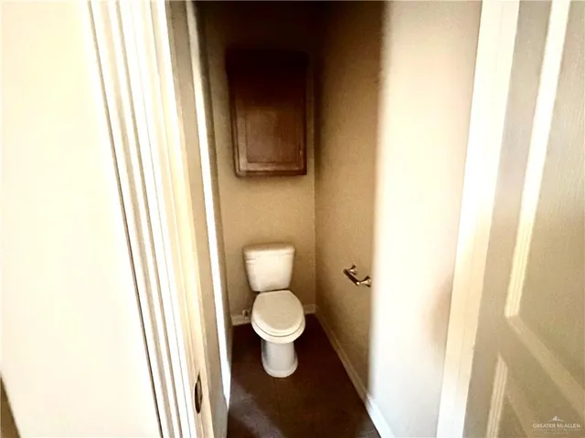 a bathroom with a toilet and a sink