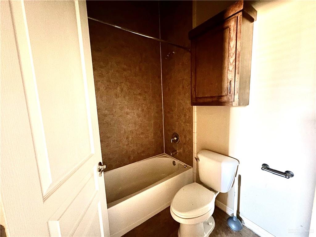 2715 Mimosa Street, Unit 3 Mission, TX 78574 - Photo 7 of 13 a bathroom with a toilet and a shower