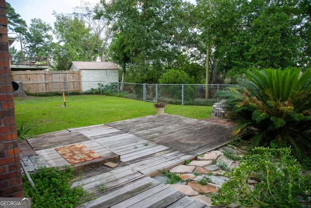 a backyard of a house with lots of green space