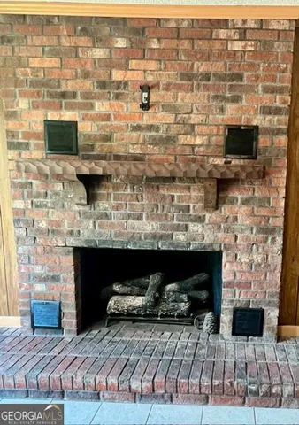 a view of fireplace and microwave