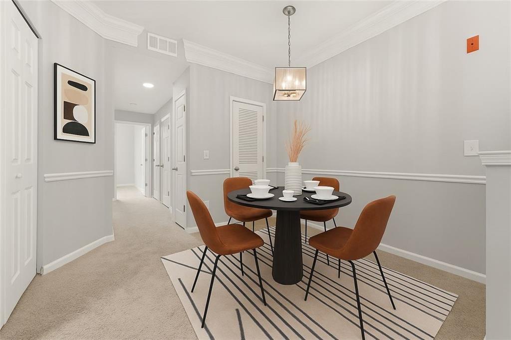 1752 Pryor Road Southwest, Unit 111 Atlanta, GA 30315 - Photo 6 of 21 a view of a dining room with furniture and wooden floor