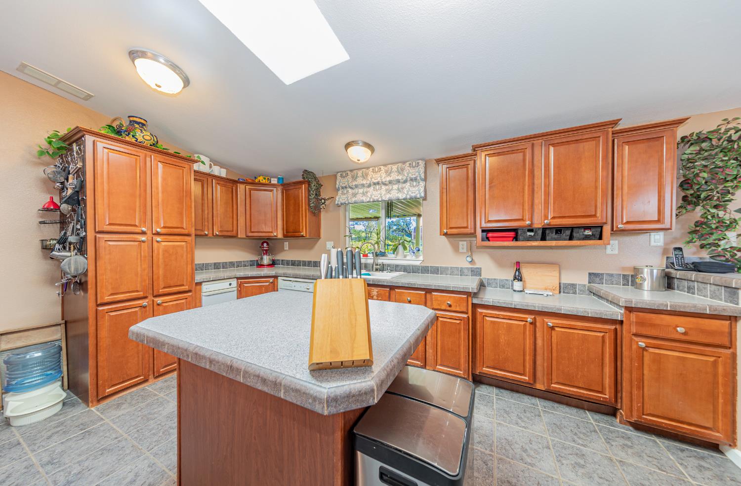 3335 Wildcat Road Mariposa, CA 95338 - Photo 12 of 48 a kitchen with stainless steel appliances granite countertop a sink a stove and refrigerator