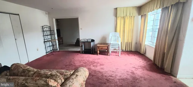 a bed room with a bed and a window