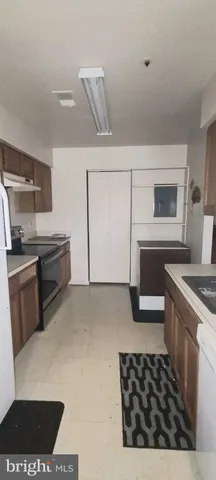 a kitchen with a stove and a microwave