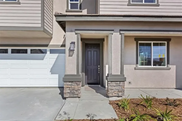 a front view of a house with entryway