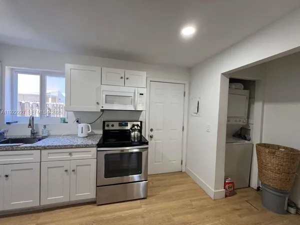 a kitchen with a stove and a refrigerator