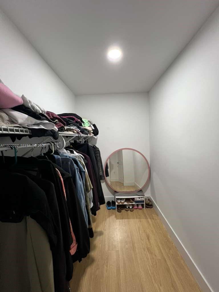 1480 Northeast 151st Street, Unit 101 Miami, FL 33162 - Photo 23 of 26 a view of a room with gym equipment
