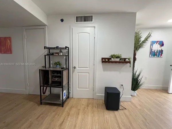 a room with a table and a potted plant