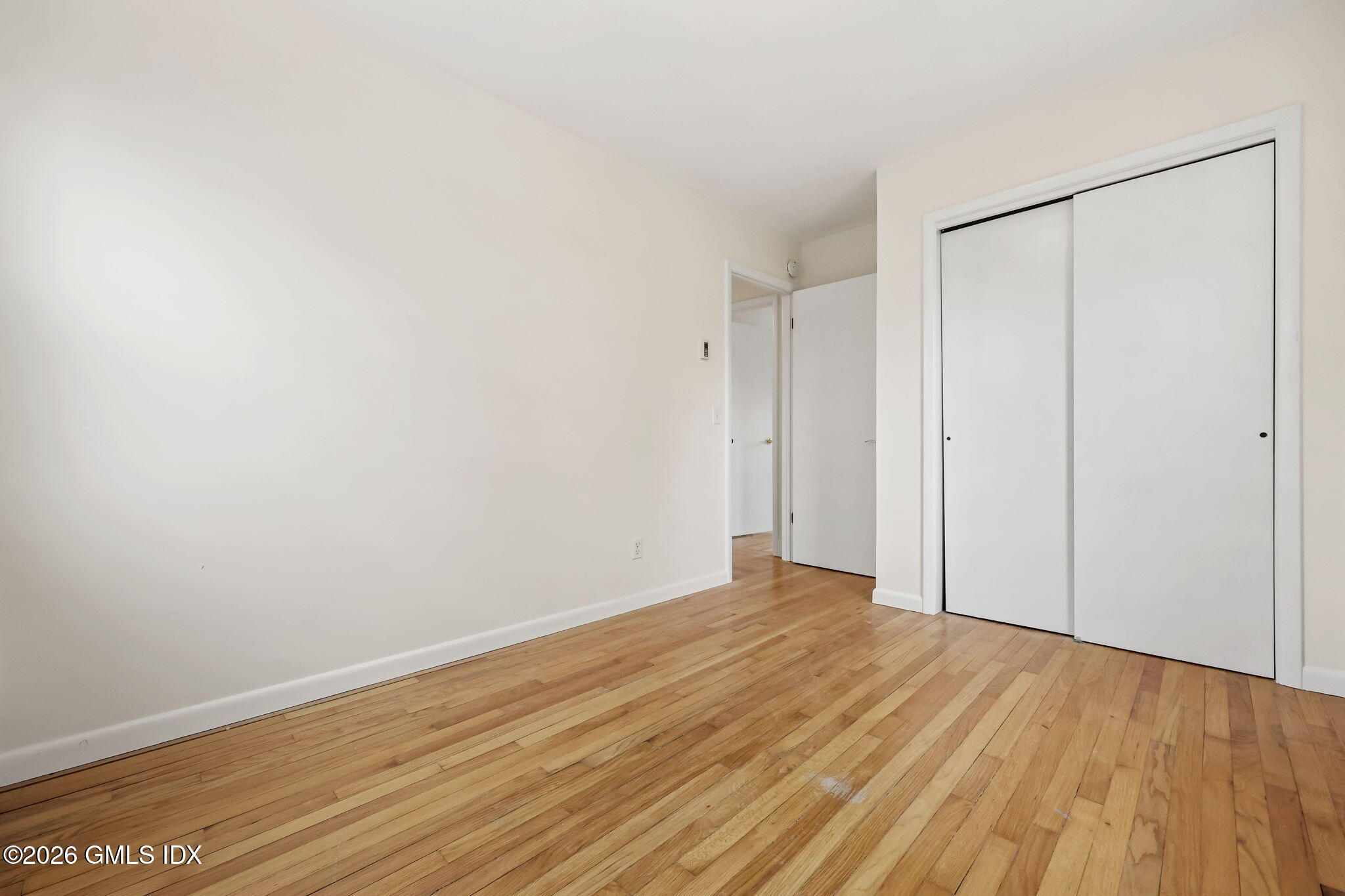 2 Grange Street Greenwich, CT 06830 - Photo 12 of 31 a view of an empty room with wooden floor