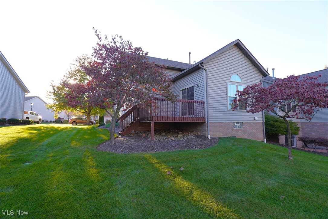 2502 Charing Cross Road Northwest Canton, OH 44708 - Photo 2 of 12 Rear view of house with a yard and a wooden deck