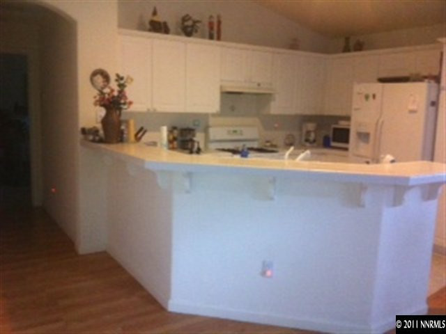 1708 Trek Trail Reno, NV 89521 - Photo 6 of 10 a room with granite countertop cabinets and sink