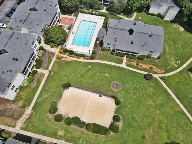 an aerial view of a house with a swimming pool