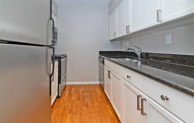 a view of a kitchen with a sink and dishwasher