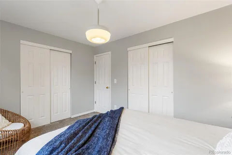 a bedroom with bed and a window