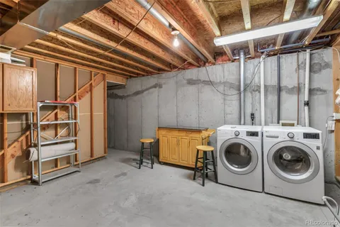 a view of a backyard with wooden fence
