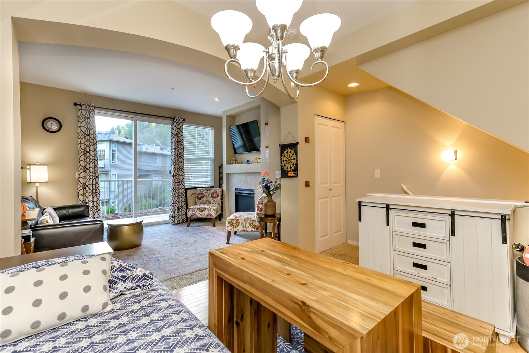 15325 Southeast 155th Place, Unit I3 Renton, WA 98058 - Photo 8 of 31 a bedroom with furniture and a chandelier