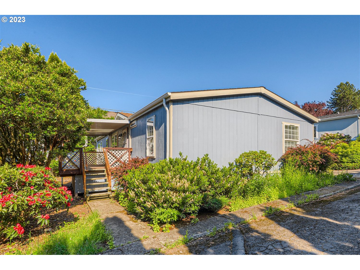 4239 Southeast 122nd Avenue, Unit 14 Portland, OR 97236 - Photo 1 of 11 a view of a house with a garden