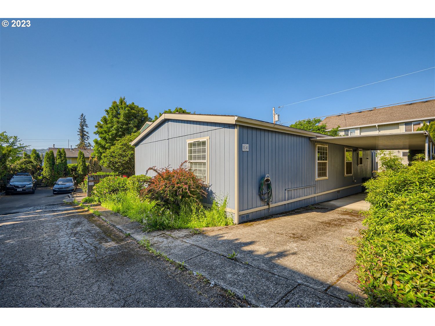 4239 Southeast 122nd Avenue, Unit 14 Portland, OR 97236 - Photo 2 of 11 a view of a house with a patio
