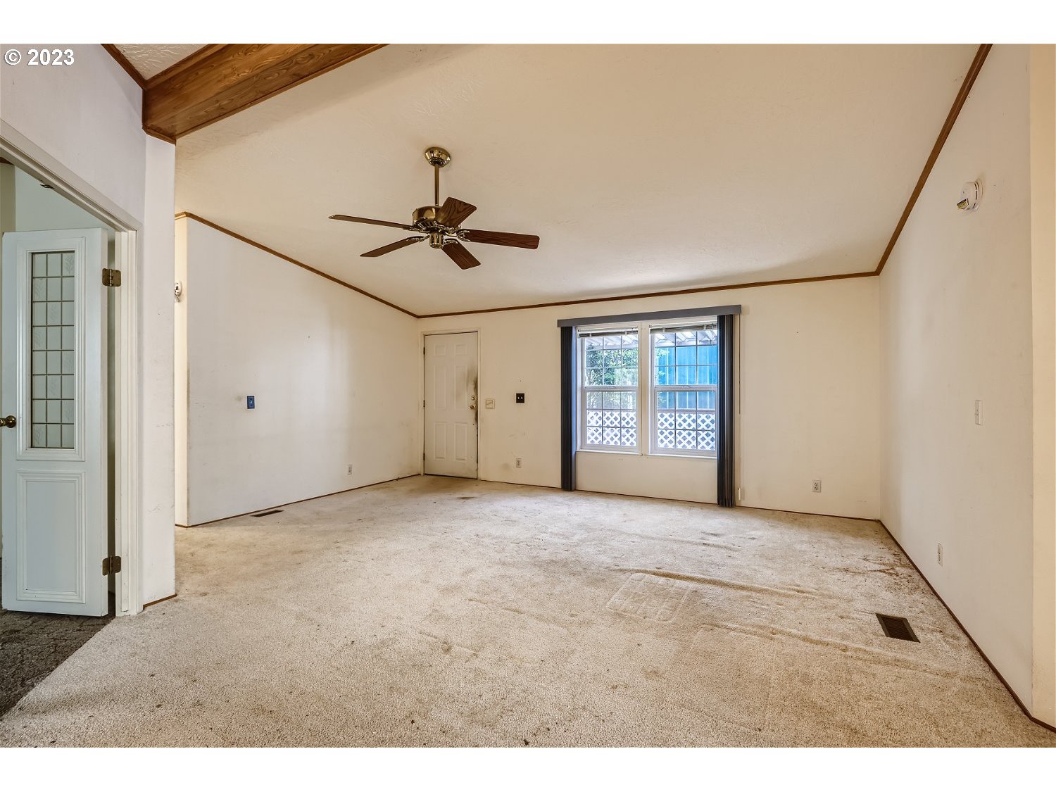4239 Southeast 122nd Avenue, Unit 14 Portland, OR 97236 - Photo 3 of 11 a view of an empty room with a window