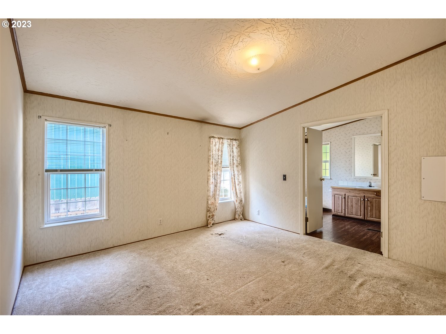 4239 Southeast 122nd Avenue, Unit 14 Portland, OR 97236 - Photo 6 of 11 a view of an empty room with a window