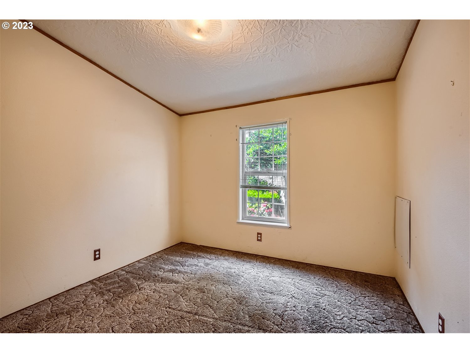 4239 Southeast 122nd Avenue, Unit 14 Portland, OR 97236 - Photo 8 of 11 a view of an empty room with a window