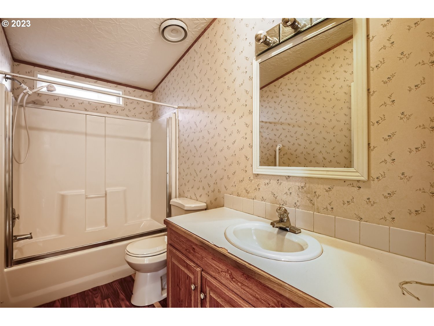 4239 Southeast 122nd Avenue, Unit 14 Portland, OR 97236 - Photo 10 of 11 a bathroom with a sink a toilet and shower