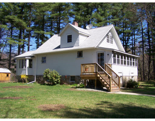 19 Hiley Brook Road Stow, MA 01775 - Photo 1 of 5 a view of a house with a yard