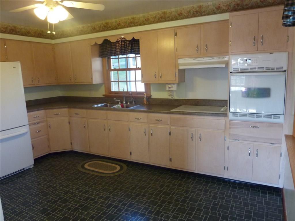 30 South Petrie Road Coraopolis, PA 15108 - Photo 11 of 25 The kitchen has been updated from its original version with new cabinets, flooring, electric cook top, built-in oven, range hood and more.
