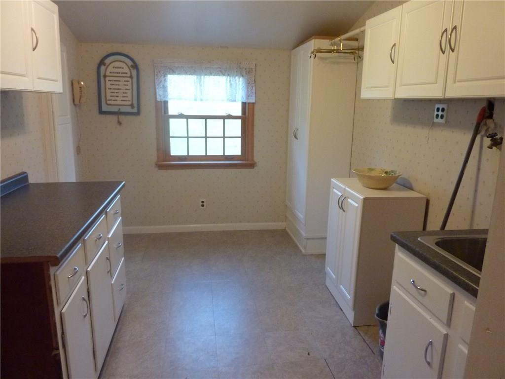 30 South Petrie Road Coraopolis, PA 15108 - Photo 14 of 25 HUGE first floor laundry room Has plenty of counter space for folding, storage cabinets, ironing board and laundry tub.