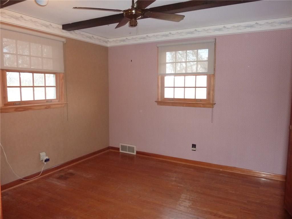 30 South Petrie Road Coraopolis, PA 15108 - Photo 17 of 25 The 2nd bedroom is also spacious and has the hardwood floors showing.