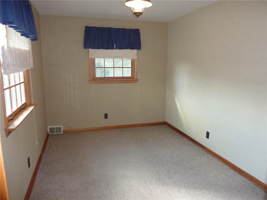 30 South Petrie Road Coraopolis, PA 15108 - Photo 19 of 25 The 4th bedroom is also a nice size room featuring carpet flooring and wood trim.