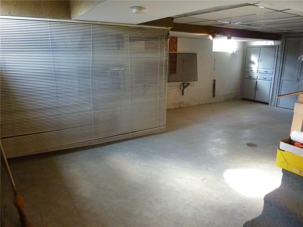 30 South Petrie Road Coraopolis, PA 15108 - Photo 22 of 25 The large basement was used as a craft room and features plenty of storage, a full bath and access to the garage.