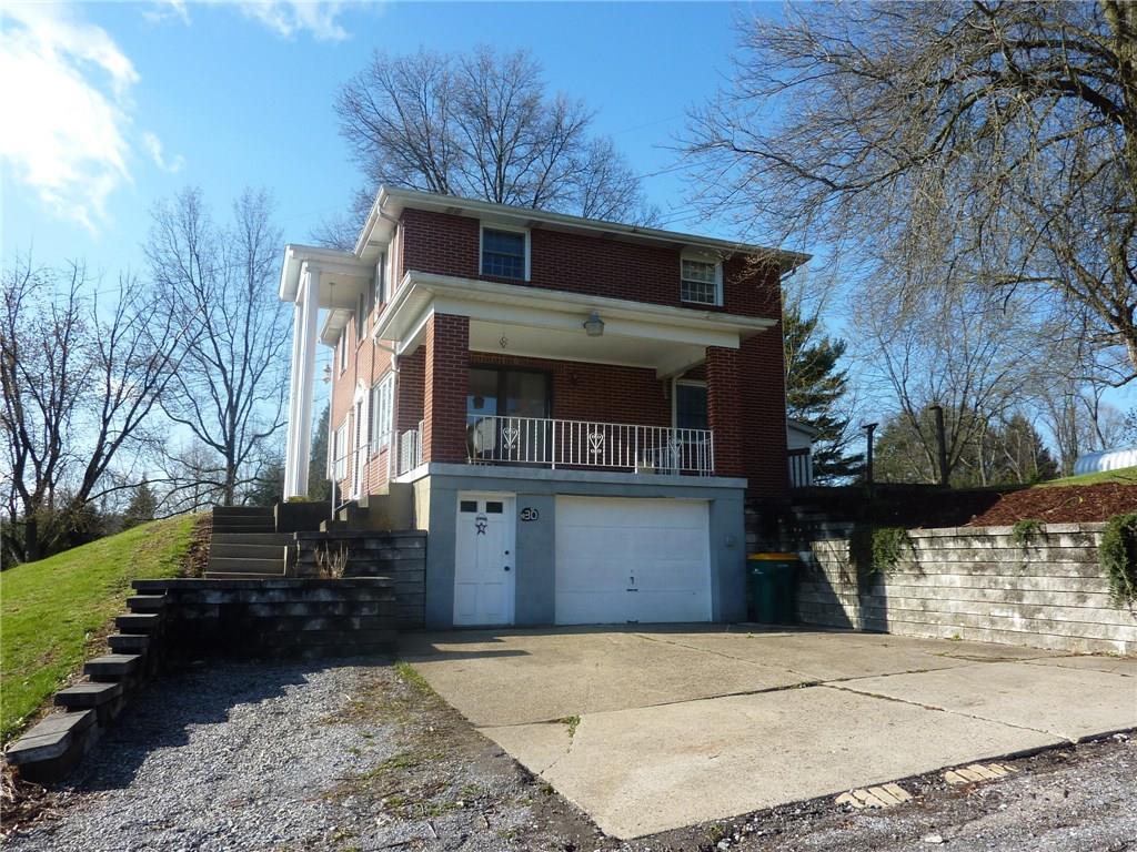 The large covered porch is great for relaxing on. Parking is never an issue as the home was designed with a 2 car garage size but was used as a work shop for the owner. 