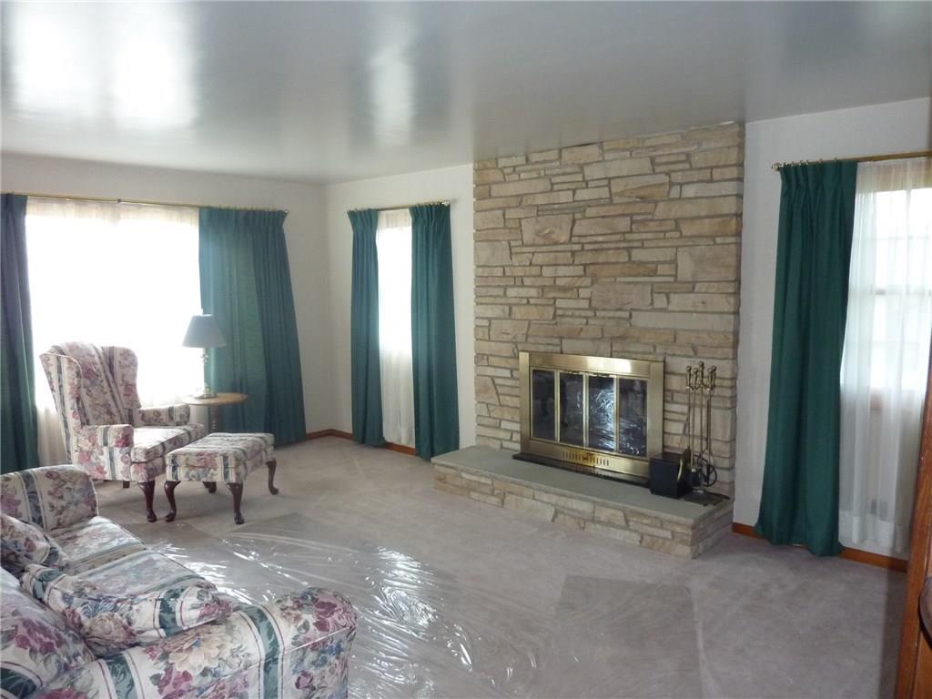30 South Petrie Road Coraopolis, PA 15108 - Photo 8 of 25 Large family room is flooded with streaming natural light enhancing the log burning stone fireplace.