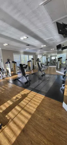 a gym room with lots of chairs