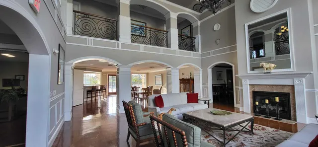 a view of a livingroom with furniture and a fireplace