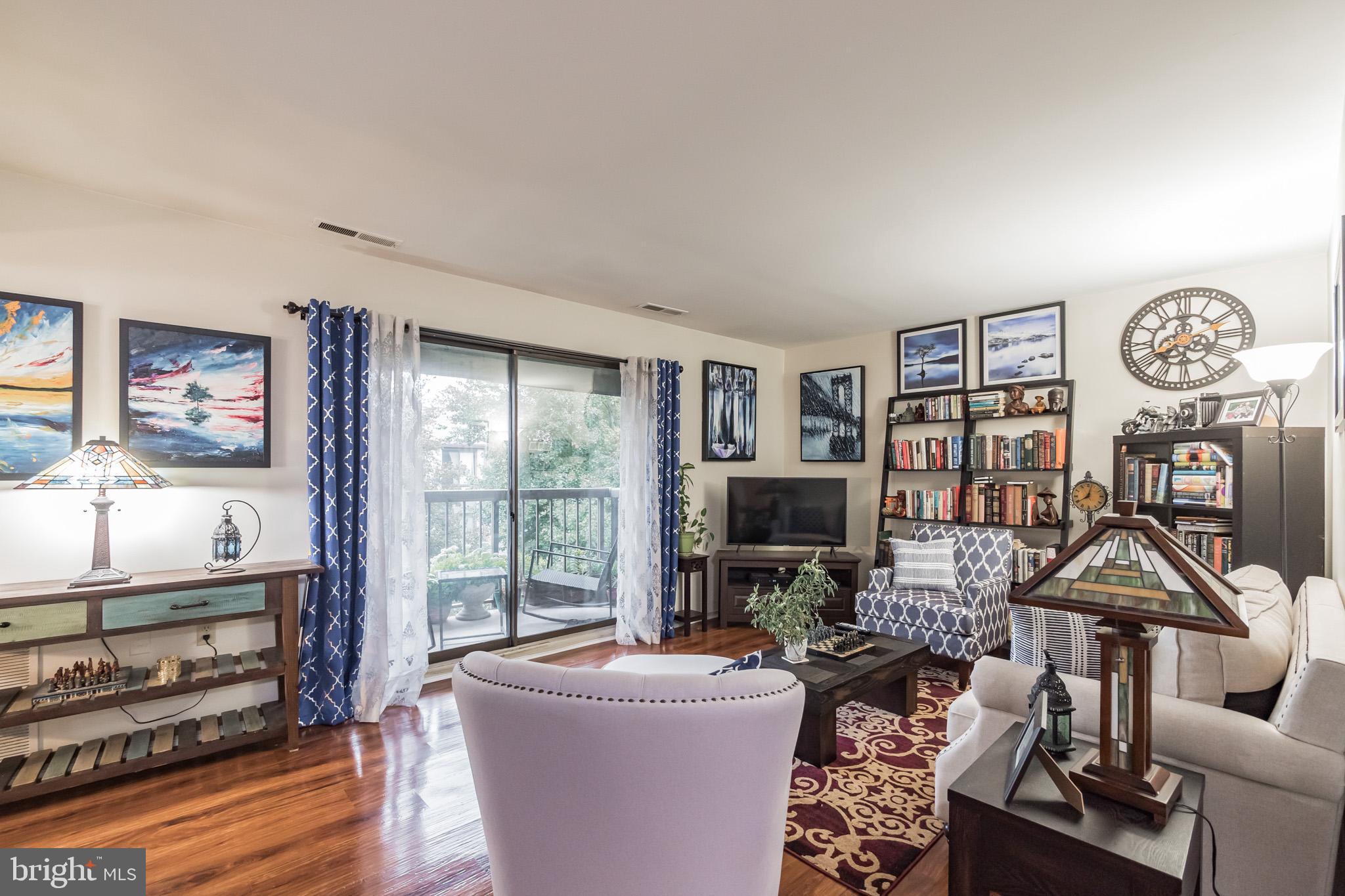 10020 Stedwick Road, Unit 304 Gaithersburg, MD 20886 - Photo 14 of 28 Living Room w/ Balcony Access