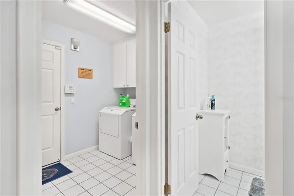 a bedroom with a bed and a ceiling fan