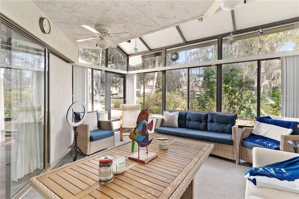 a aerial view of a house next to a yard