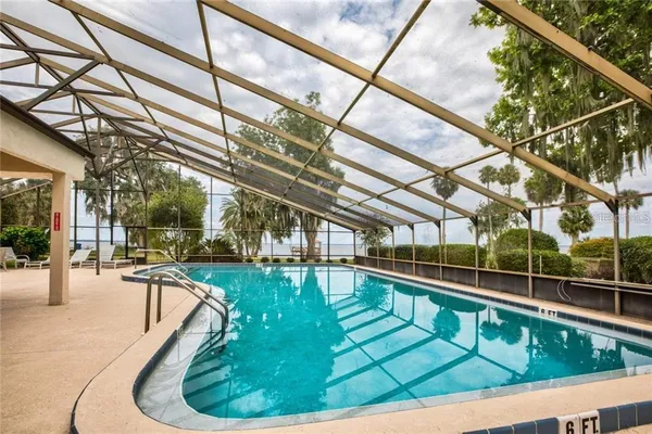 a view of a swimming pool with lounge chair