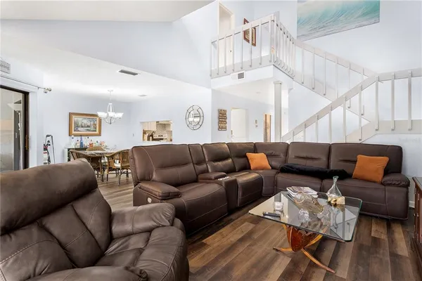 a kitchen with cabinets appliances a sink and a window