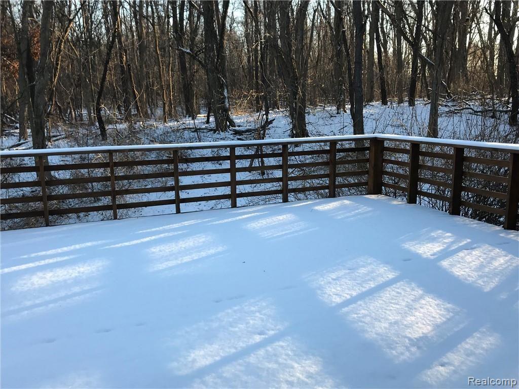 7058 Ridgewood Road Clarkston, MI 48346 - Photo 6 of 17 Back deck looking out to wood property