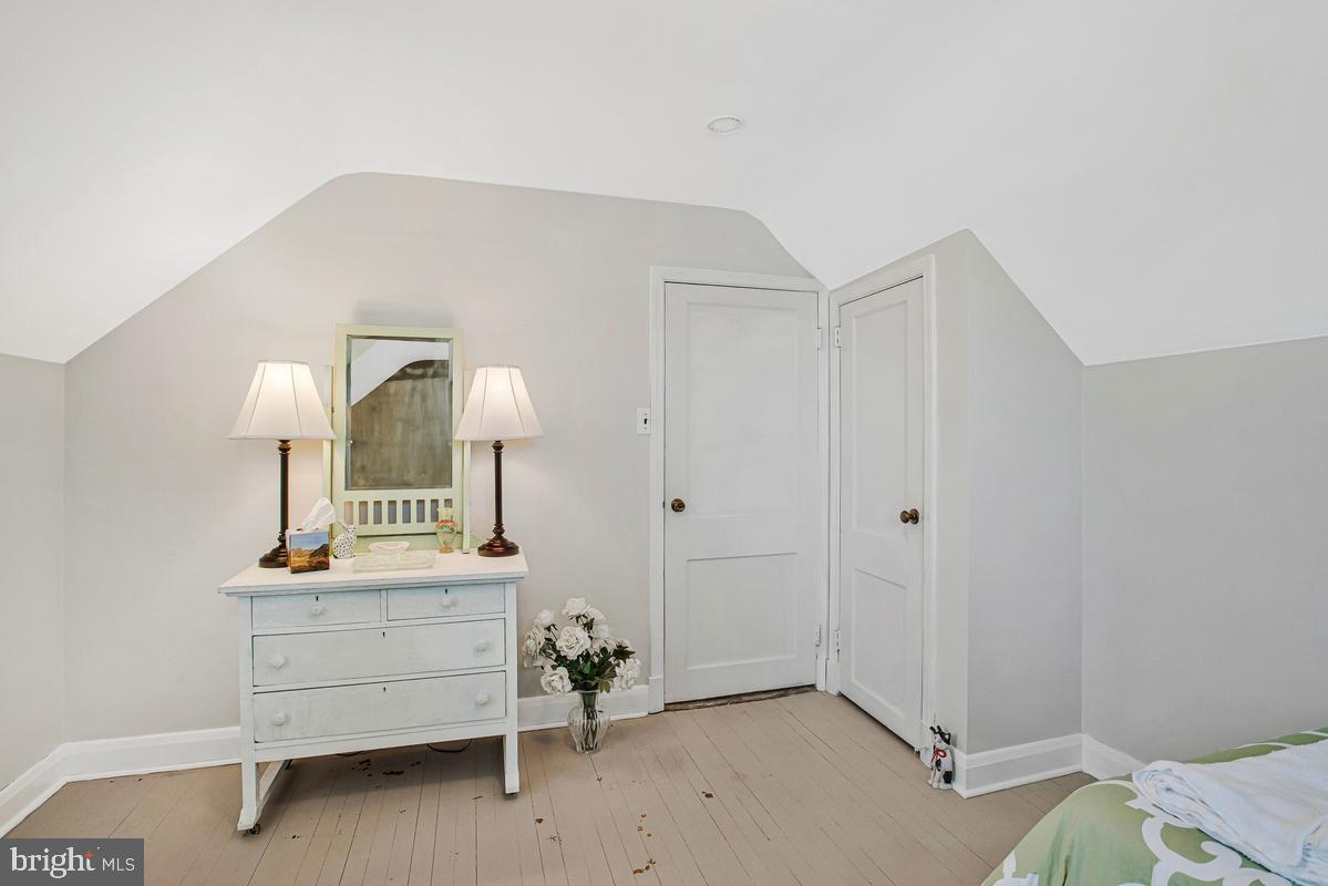 601 Forest View Road Linthicum Heights, MD 21090 - Photo 30 of 37 a view of a room that has a bed and a dresser in it