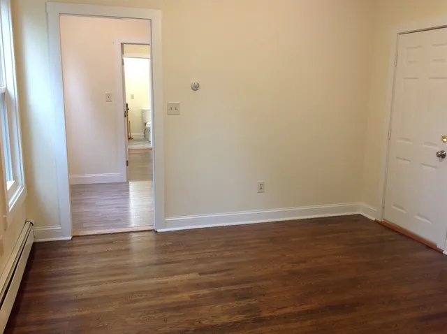 a view of wooden floor in an empty room